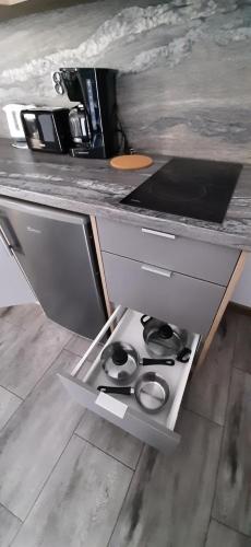 a kitchen with a stove and a counter top at Apartamenty Jasieńczyk in Mielenko