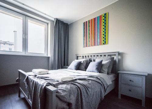 Posteľ alebo postele v izbe v ubytovaní Grey House Warsaw