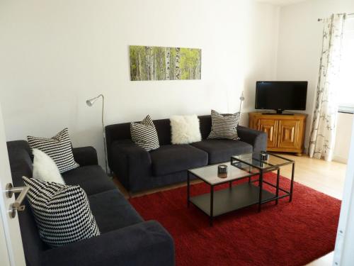 a living room with a couch and a coffee table at Ferienwohnungen Nora in Bad Neuenahr-Ahrweiler