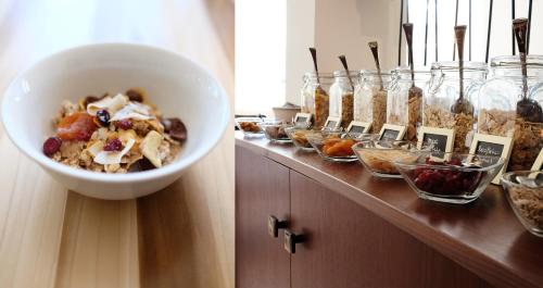 a buffet with a bowl of food on a counter at Parkhotel Obermenzing in Munich