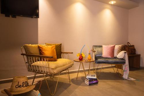 a living room with two chairs and a table at Dellarosa Boutique Hotel and Spa in Marrakech