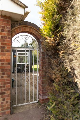 an entrance to a brick building with an iron gate at The Nook in West Mersea