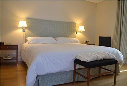 מיטה או מיטות בחדר ב-Hotel Finca Hermitage
