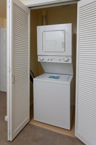 a white washer and dryer in a room at WorldMark Long Beach in Long Beach