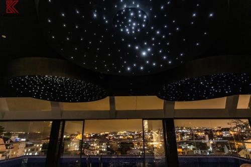 a view of the city from the top of a building at night at TTR Skypool View Hotel in Da Lat