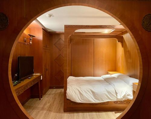 Postel nebo postele na pokoji v ubytování Yoshi Hotel - Tainan Station Branch