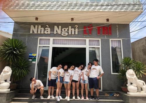 a group of people standing in front of a building at Ly Tri Ly Son Hotel in Ly Son