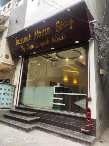 a store front of a store with a sign on it at Jasneet Homestay in Amritsar