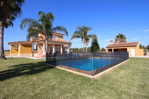 a house with a swimming pool in a yard at Finca las Ranas by CARLOSFERIEN in Denia