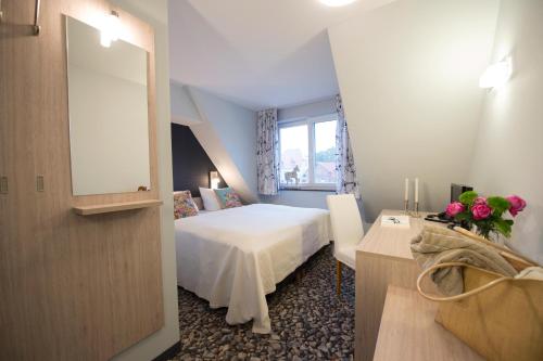 Ένα ή περισσότερα κρεβάτια σε δωμάτιο στο Die Remise Condé RE-10