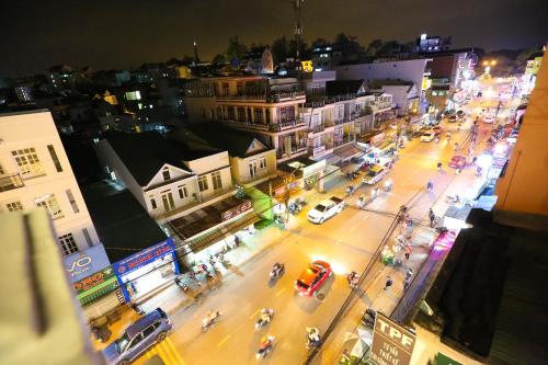 an overhead view of a city street at night at TTR An Nam Apart Hotel in Da Lat