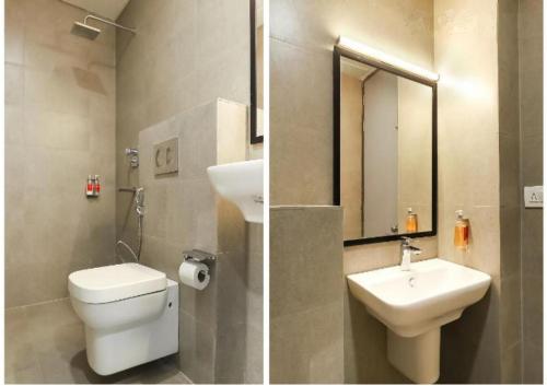 y baño con aseo, lavabo y espejo. en Hotel Kingston House, en Lucknow