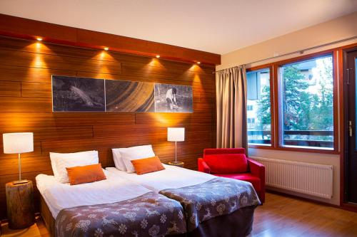 Ένα ή περισσότερα κρεβάτια σε δωμάτιο στο Lapland Hotels Riekonlinna