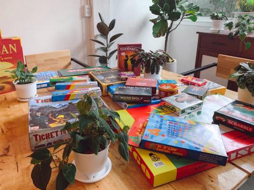 a pile of books sitting on top of a table at Pillow & Bread in Bangkok