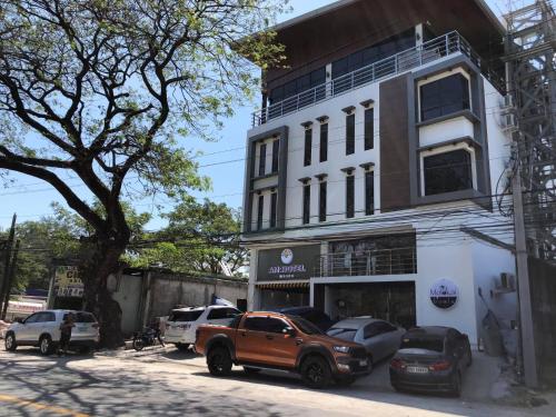 a truck parked in front of a building at A.M @ 93rd HOTEL in Olongapo