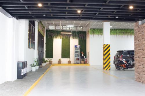 a parking garage with a motorcycle parked in it at A.M @ 93rd HOTEL in Olongapo