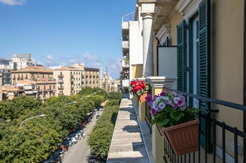a balcony with flower boxes on a building at Best Western Ai Cavalieri Hotel in Palermo