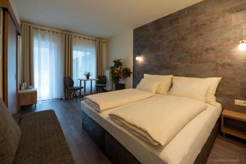 เตียงในห้องที่ Apartmány I - KAfe Bojnice