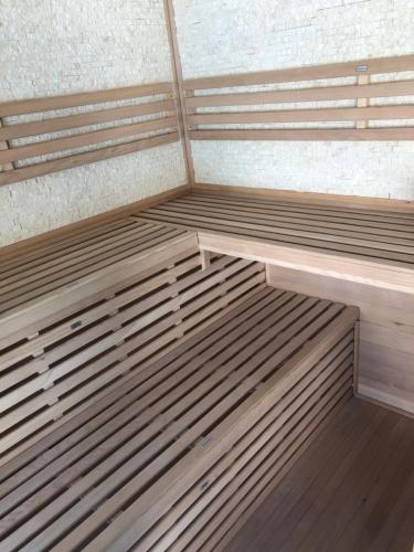 a room with two wooden bunk beds in it at Villa del catalunya in Perpignan