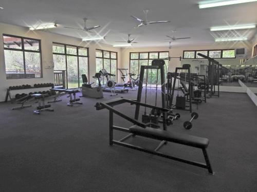 a gym with a lot of equipment in a room at Fairways Holiday Accommodation in Drakensberg Garden