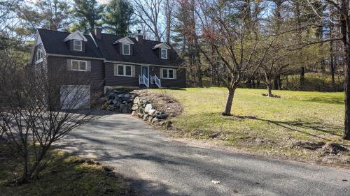 a house on a hill with a road in front at Private Berkshire Escape Special April Pricing select your dates for discount Monthly Pricing in Lee
