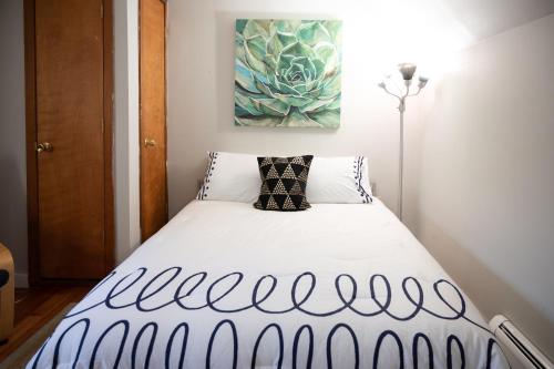 a bed in a room with a painting on the wall at Private Berkshire Escape Special April Pricing select your dates for discount Monthly Pricing in Lee