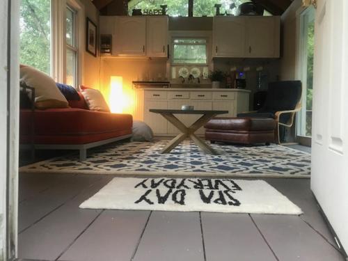 a living room with a couch and a table at Private Berkshire Escape Special April Pricing select your dates for discount Monthly Pricing in Lee