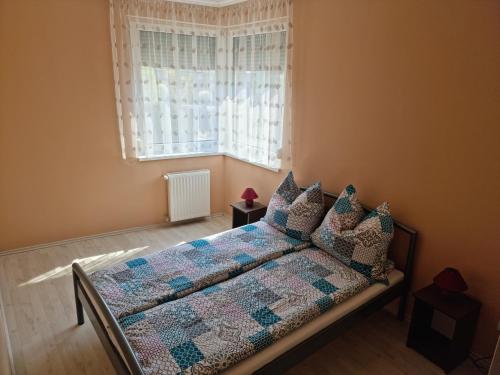 Posteľ alebo postele v izbe v ubytovaní Betti Apartman