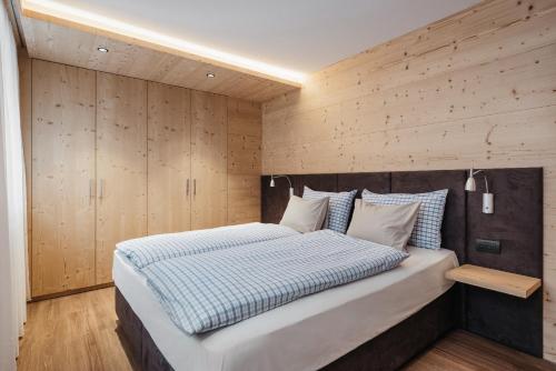 Кровать или кровати в номере Appartamenti Ciasa Hanny