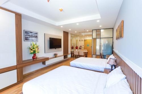 TMS Beachfront Quy Nhon Apartmentにあるベッド