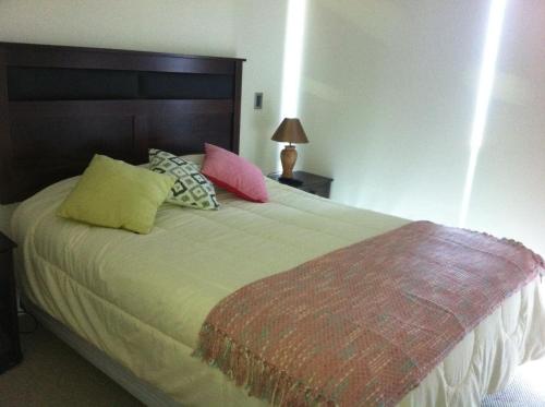 Krevet ili kreveti u jedinici u okviru objekta Jardin del Mar Costanera