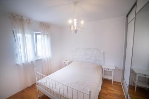 Кровать или кровати в номере Apartment Plamenatz