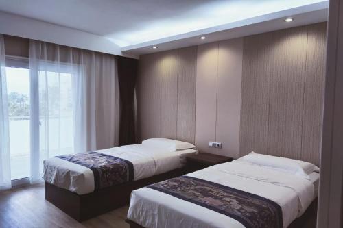 Tempat tidur dalam kamar di Hotel Nueva Europa