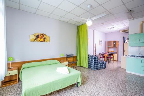 a hospital room with a bed and a table at Residence Daniele in Bellaria-Igea Marina