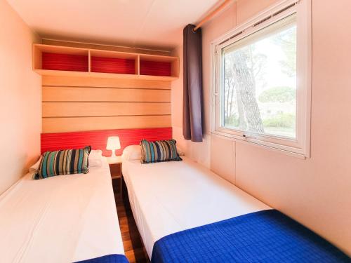 Voodi või voodid majutusasutuse Bungalow Maite toas