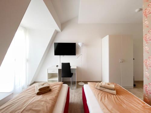 Posteľ alebo postele v izbe v ubytovaní Pension Voesendorf