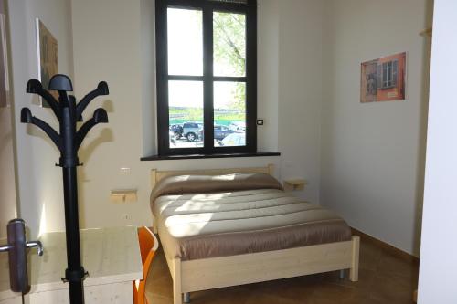 En eller flere senger på et rom på Student's Hostel Parma