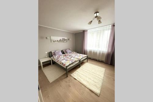 Tempat tidur dalam kamar di Modern apartment in Tarnow