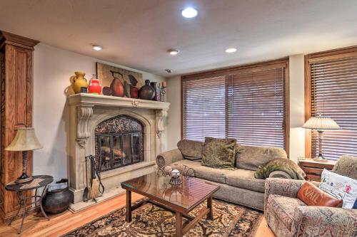 a living room with a couch and a fireplace at Updated Condo Walk to Vail Village and Ski Shuttle! in Vail