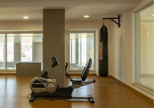 a gym with a treadmill and an exercise bike at Casa D'Olga in Lagos