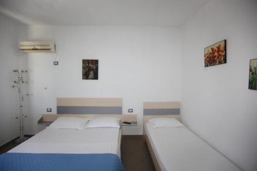Ένα ή περισσότερα κρεβάτια σε δωμάτιο στο Villa Oden