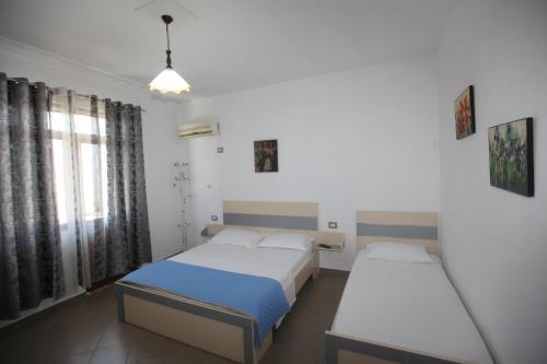 Ένα ή περισσότερα κρεβάτια σε δωμάτιο στο Villa Oden