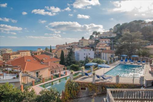 a view of a town with a swimming pool at Residence Il Poggio in Marina di Andora