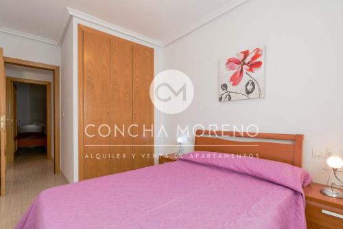 Ένα ή περισσότερα κρεβάτια σε δωμάτιο στο Costa Caribe I-II CM