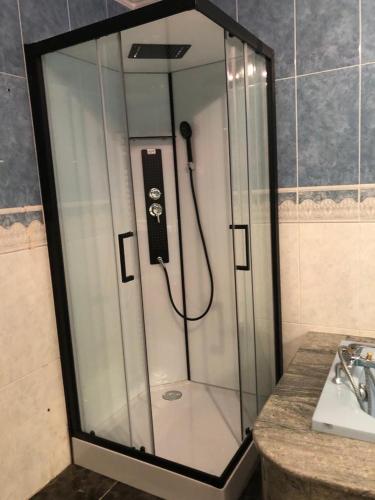 a shower in a bathroom with a sink at Villa del catalunya in Perpignan