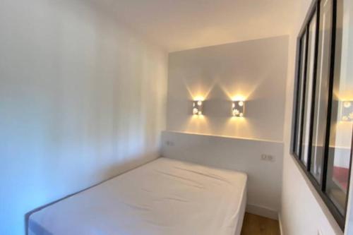 Postel nebo postele na pokoji v ubytování T2 Océan à 2 minutes à pied pour 4 + parking