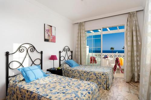 A bed or beds in a room at Villa Calma by Villa Plus