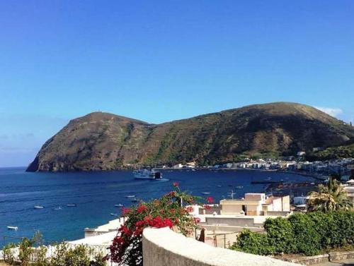 a view of a large body of water with a mountain at Oltremare Residence Hotel in Lipari