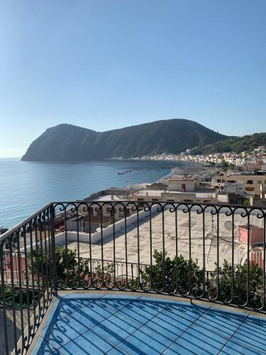 a balcony with a view of a beach and the ocean at Oltremare Residence Hotel in Lipari
