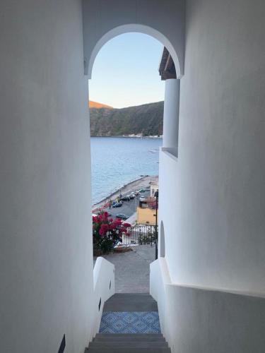a view of a beach from a building with an archway at Oltremare Residence Hotel in Lipari